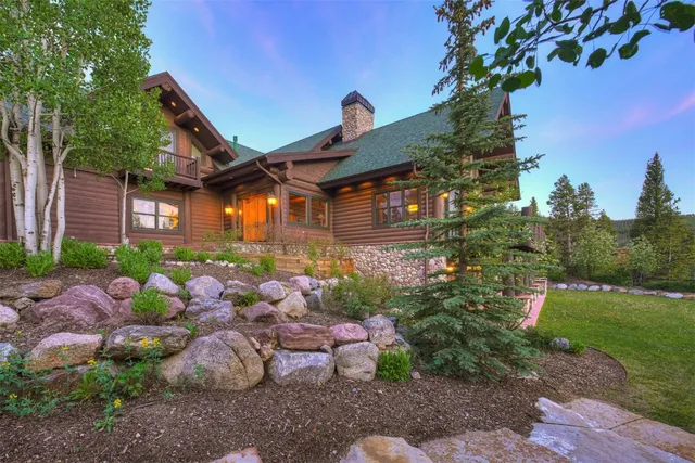 a view of a chairs and table in the roof deck