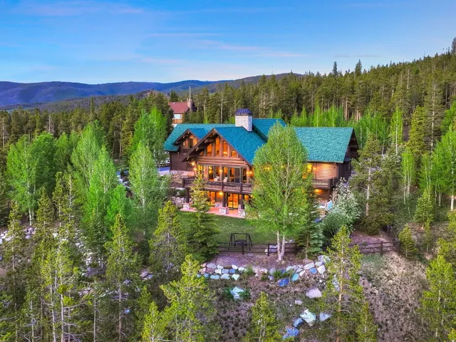 a front view of a house with a yard table and chairs