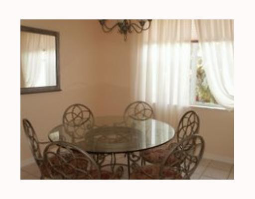 907 Stanton Drive Weston, FL 33326 - Photo 3 of 5 a dining room with furniture and window