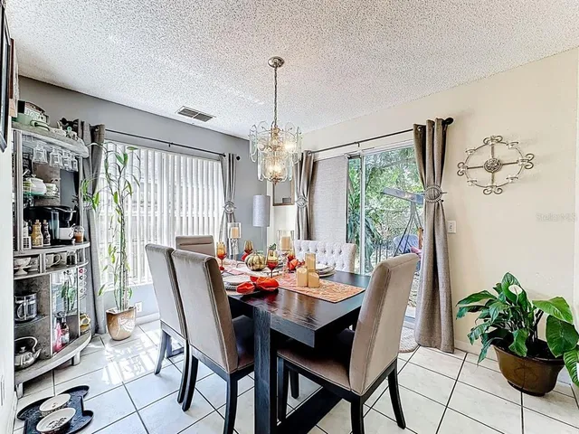 a view of a dining room with furniture window and outside view