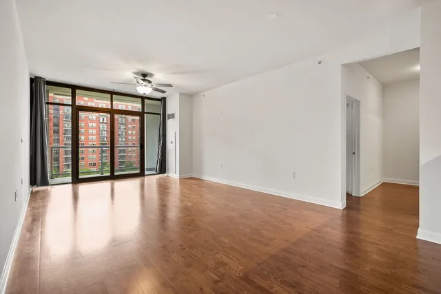 wooden floor in an empty room with a window