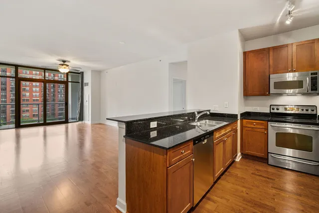 a bedroom with a large bed and a large window