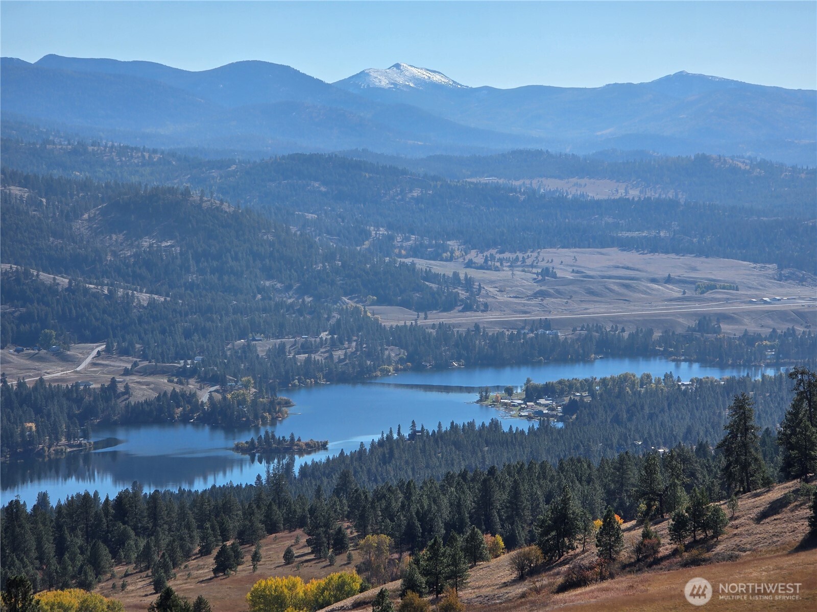 54 Hardrock Road Republic, WA 99166 - Photo 6 of 36 a view of a town with mountains in the background