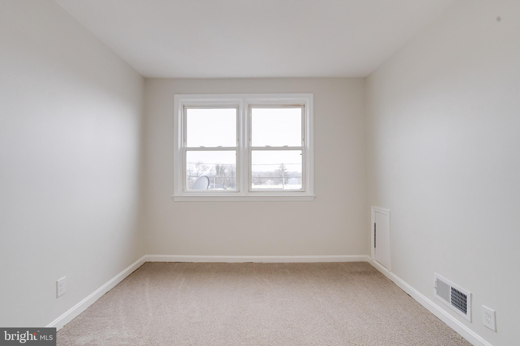 3916 2nd Street Baltimore, MD 21225 - Photo 13 of 20 an empty room with a window