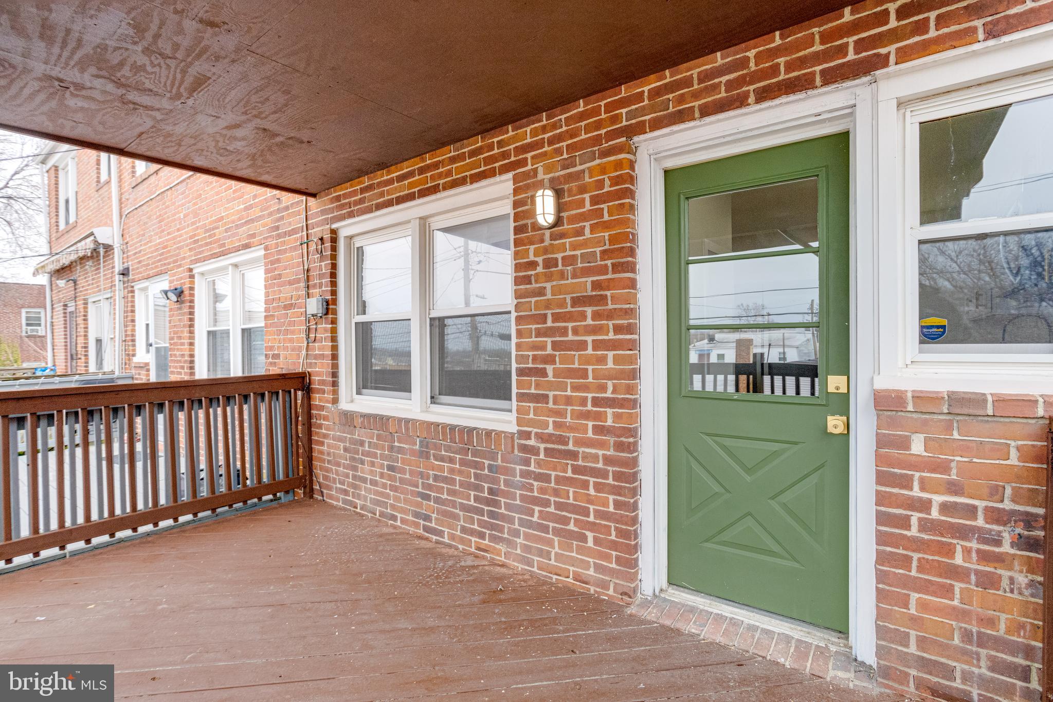 3916 2nd Street Baltimore, MD 21225 - Photo 19 of 20 a view of a brick house with a small yard