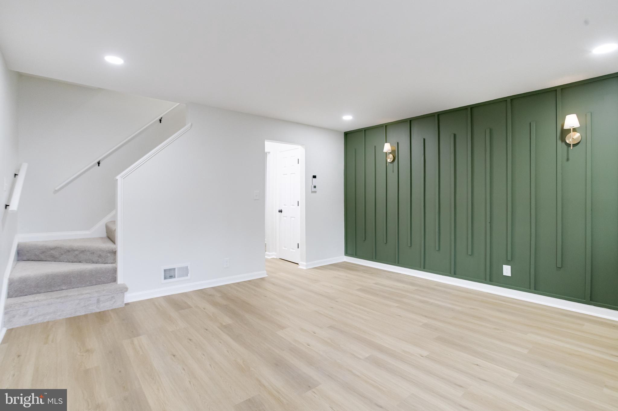 3916 2nd Street Baltimore, MD 21225 - Photo 3 of 20 a view of an empty room with wooden floor