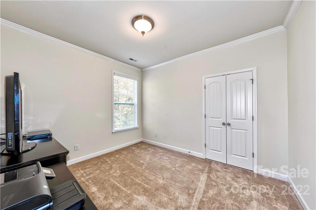 949 Solandra Way Tega Cay, SC 29708 - Photo 24 of 48 a view of a workspace with furniture and a window