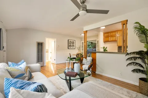 a view of a dining room with furniture and wooden floor