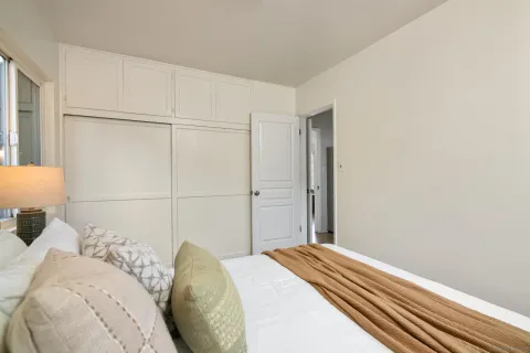 a view of a bedroom and bathroom