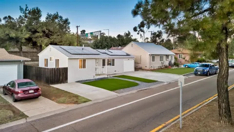 a view of front a house with a yard