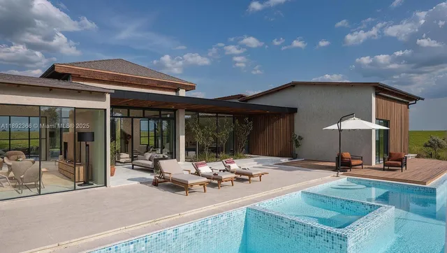 a view of a house with sitting area and furniture