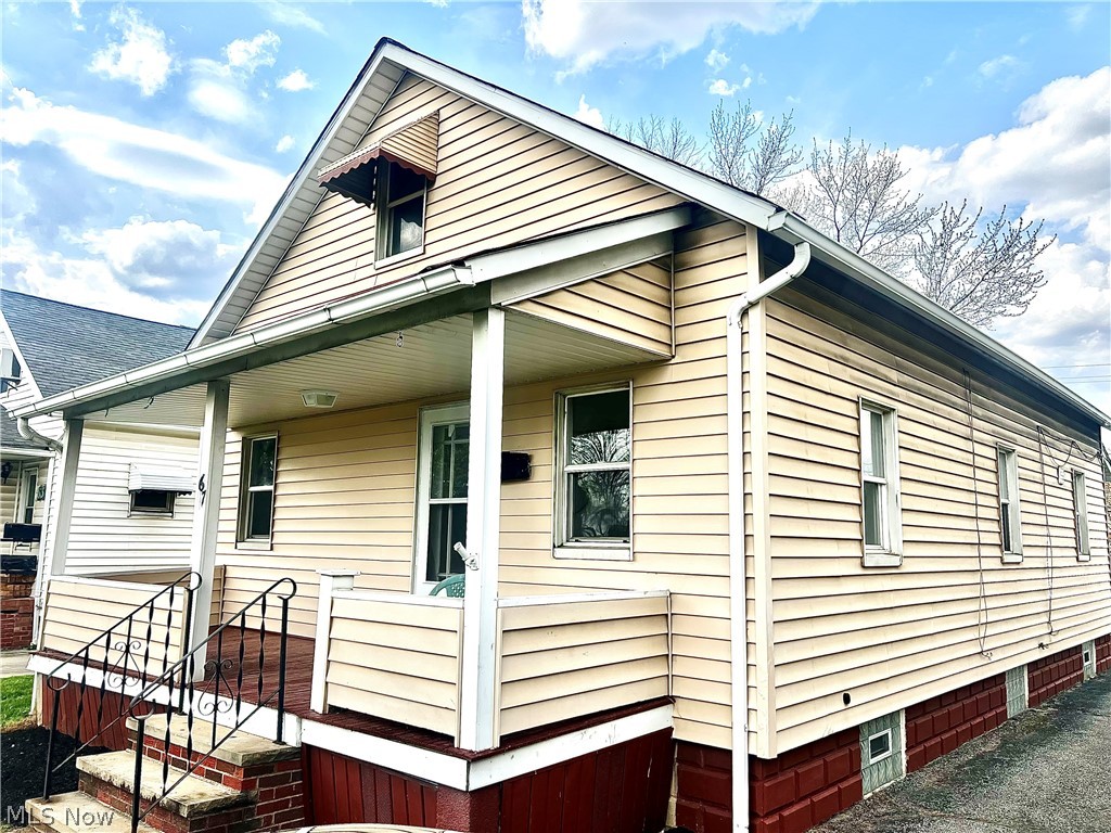 67 Forbes Road Bedford, OH 44146 - Photo 3 of 20 View of side of property with a porch