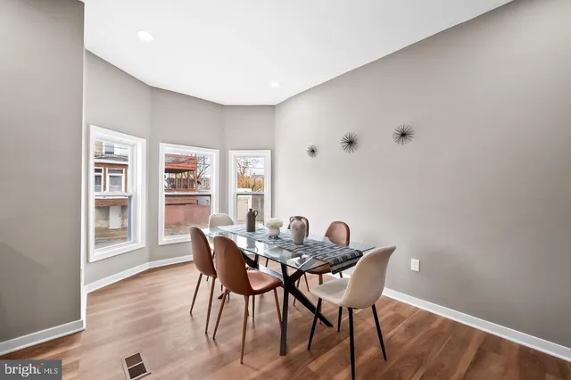 a bedroom with a bed and a night stand