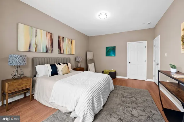 a bedroom with a bed and a dresser