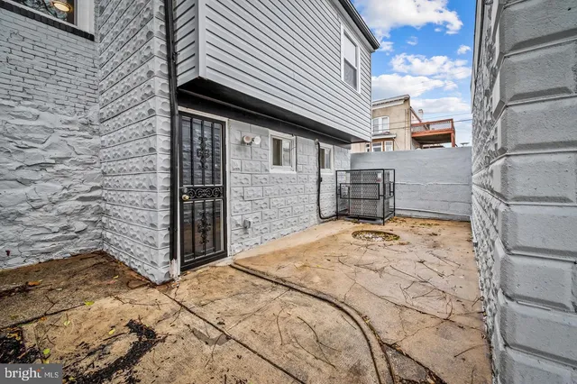 a bedroom with a bed and a wooden floor