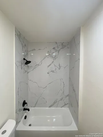 a bathroom with a bathtub