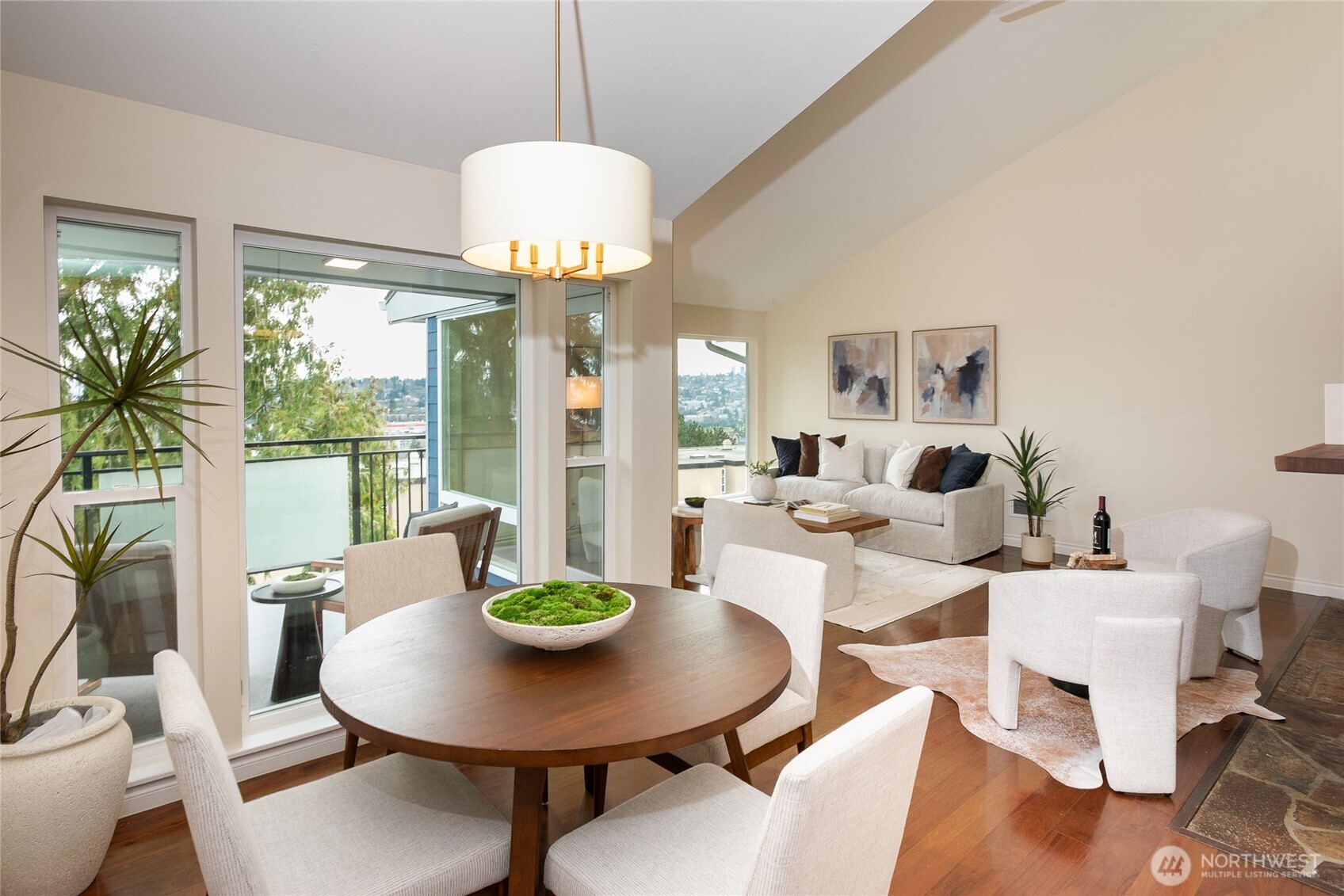 2510 West Bertona Street, Unit 428 Seattle, WA 98199 - Photo 13 of 35 a view of a dining room with furniture wooden floor and chandelier