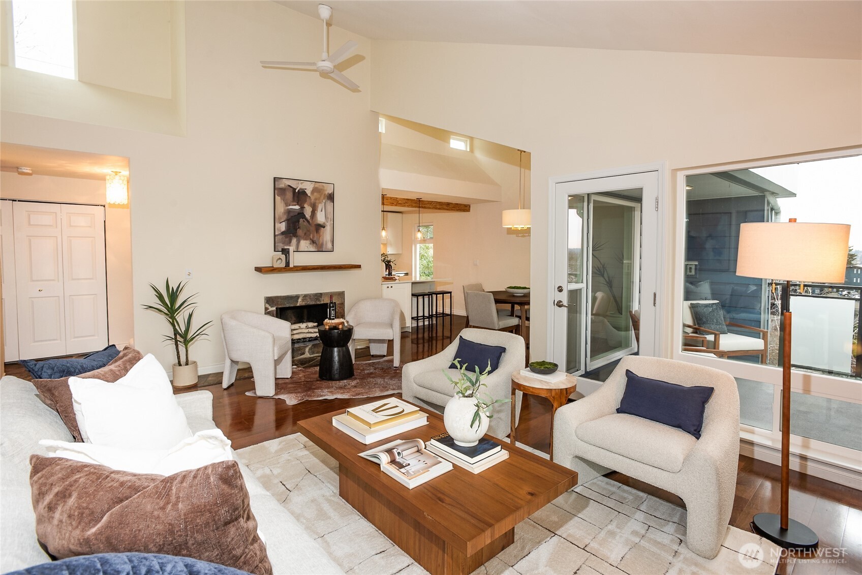 2510 West Bertona Street, Unit 428 Seattle, WA 98199 - Photo 16 of 35 a living room with furniture and a lamp