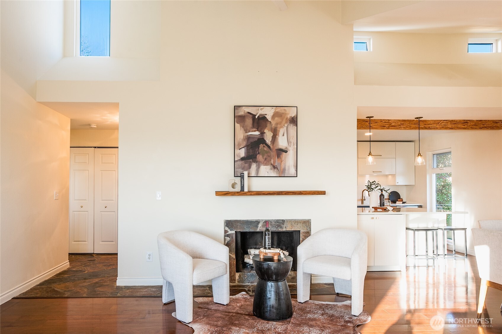 2510 West Bertona Street, Unit 428 Seattle, WA 98199 - Photo 17 of 35 a living room with furniture a fireplace and next to a window