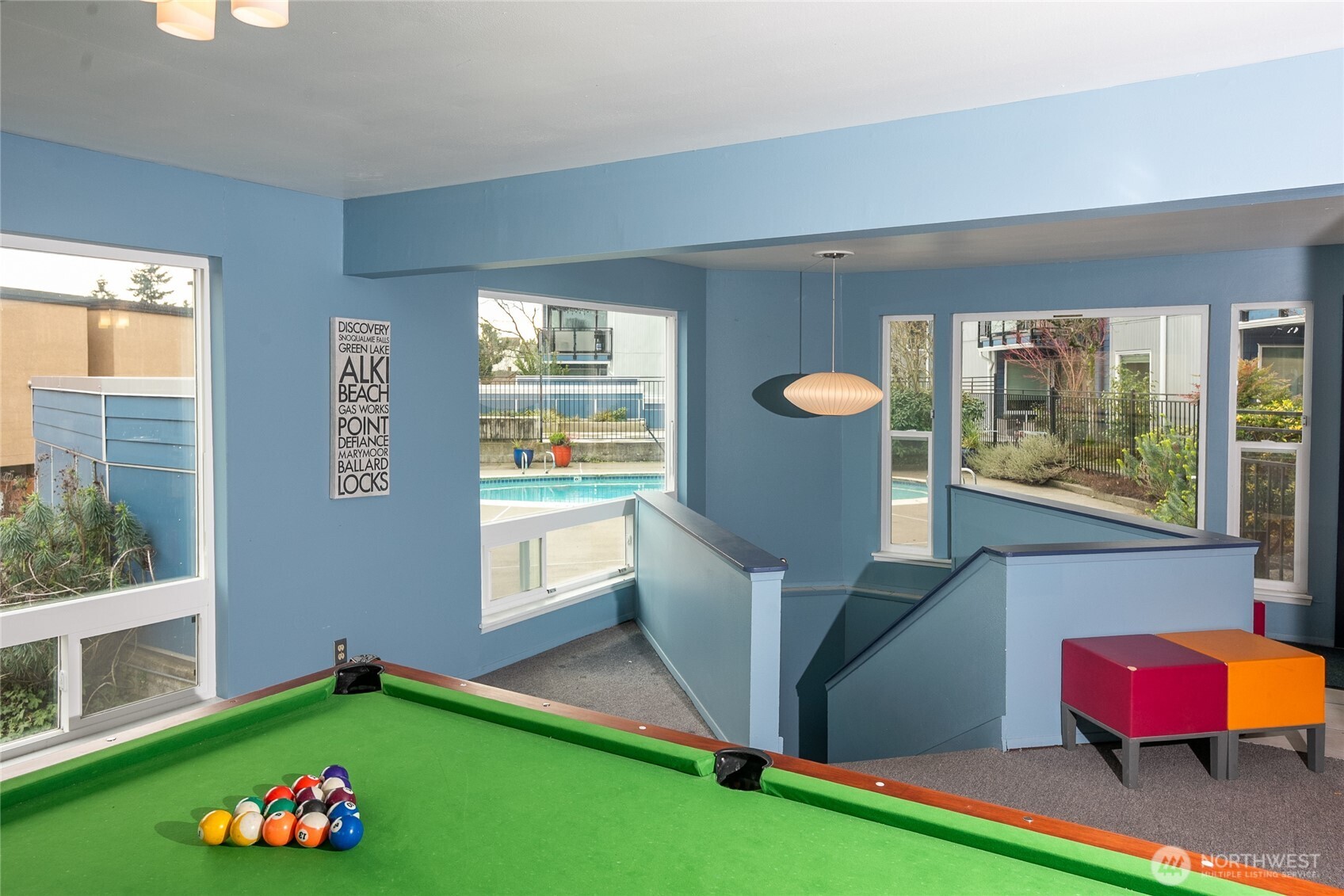 2510 West Bertona Street, Unit 428 Seattle, WA 98199 - Photo 27 of 35 a living room with furniture and a floor to ceiling window