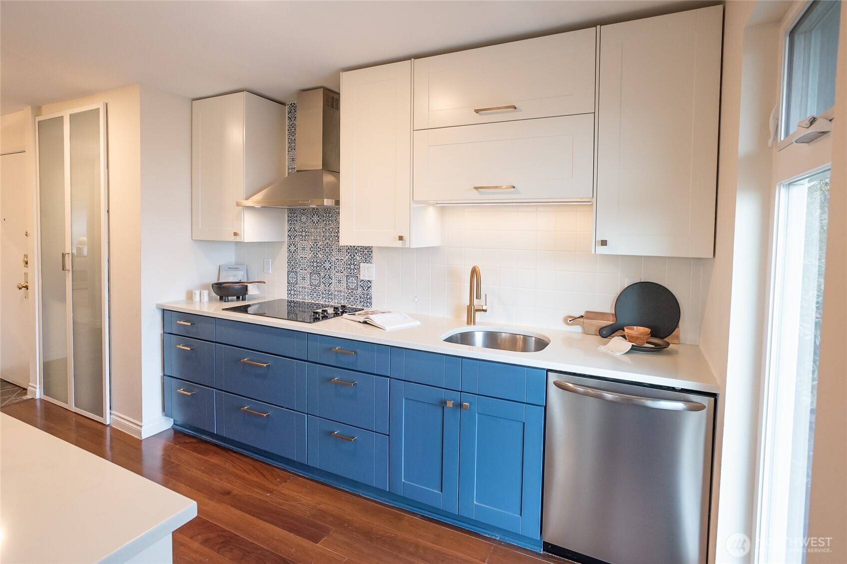 2510 West Bertona Street, Unit 428 Seattle, WA 98199 - Photo 8 of 35 a kitchen with stainless steel appliances granite countertop a sink stove and cabinets