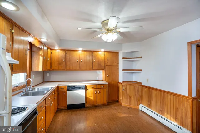 a view of a kitchen with a sink and a window