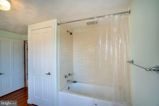 a bathroom with a toilet a sink and bathtub