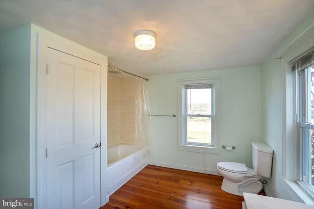 a view of a bathroom with a glass door and shower