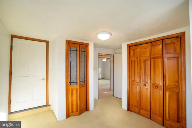a view of a hallway with staircase