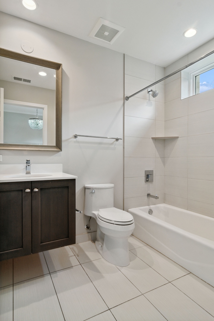 1648 South Prairie Avenue, Unit 4 Chicago, IL 60616 - Photo 19 of 30 a bathroom with a sink a toilet and shower