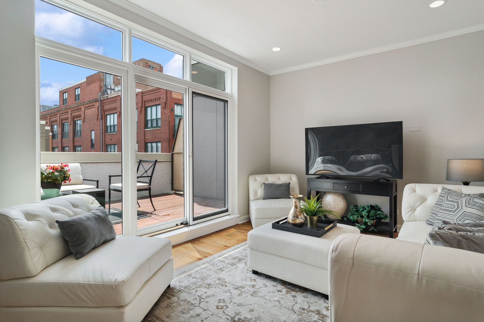 1648 South Prairie Avenue, Unit 4 Chicago, IL 60616 - Photo 22 of 30 a living room with furniture and a flat screen tv