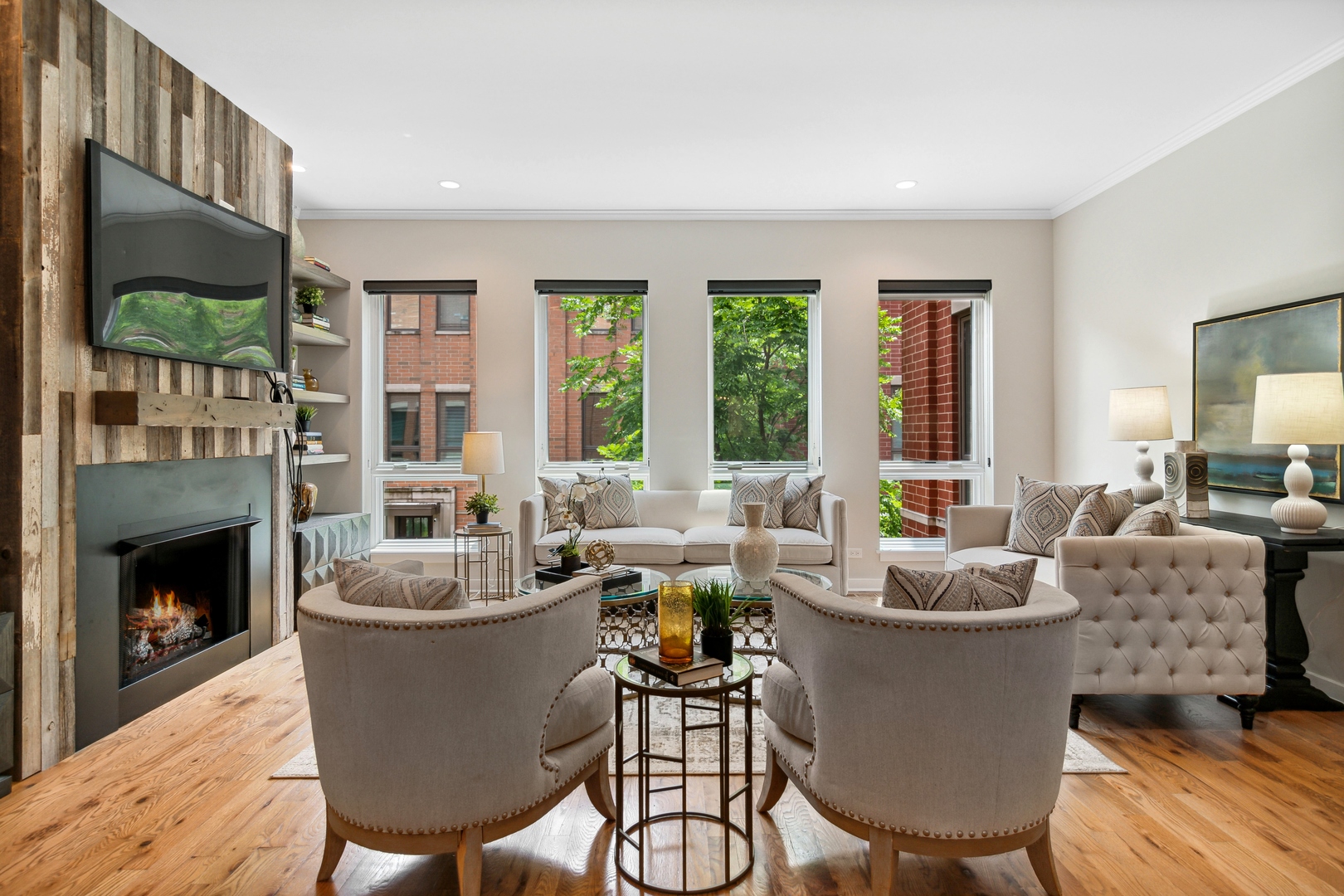 1648 South Prairie Avenue, Unit 4 Chicago, IL 60616 - Photo 4 of 30 a living room with furniture a fireplace and a floor to ceiling window