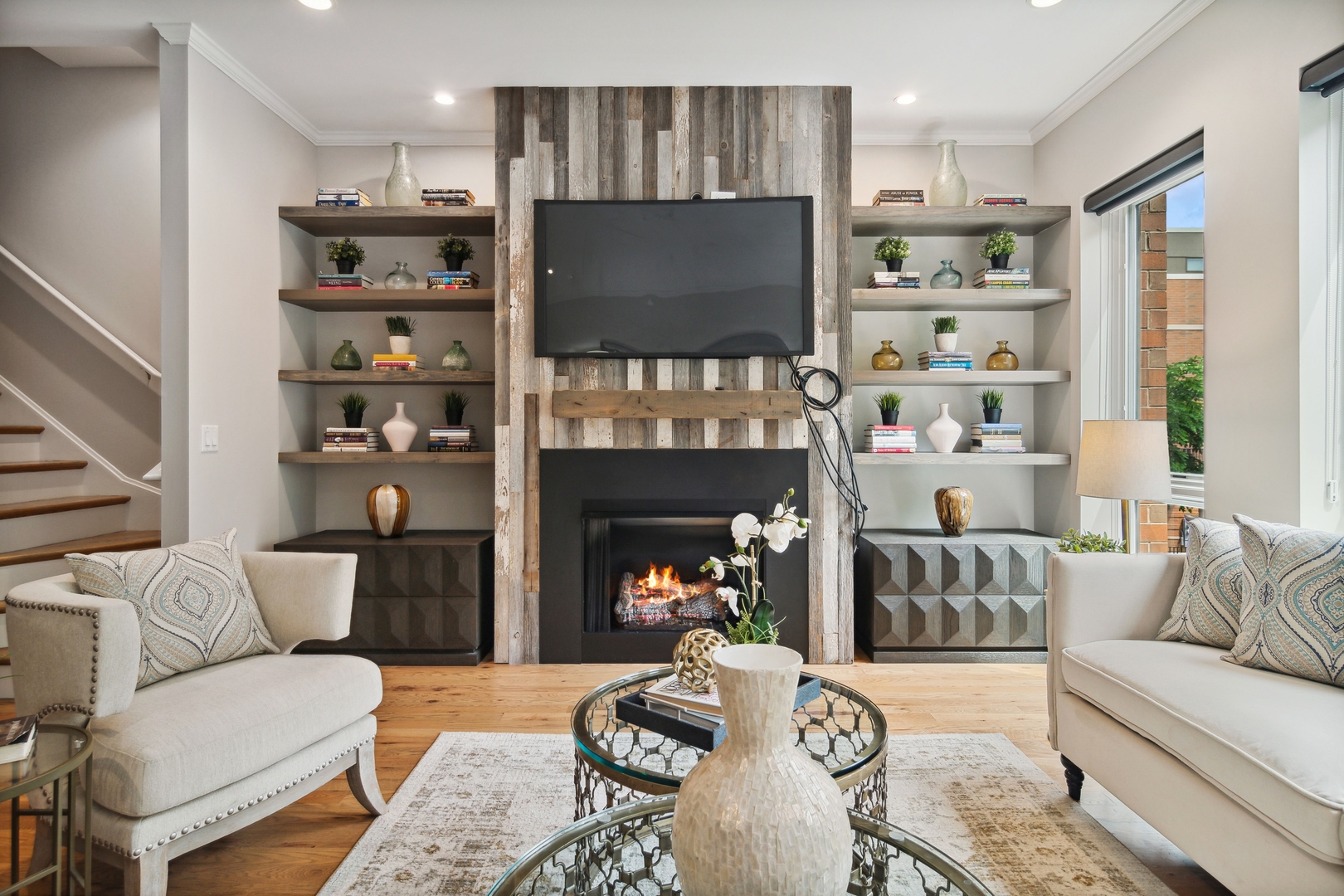 1648 South Prairie Avenue, Unit 4 Chicago, IL 60616 - Photo 5 of 30 a living room with furniture a flat screen tv and a fireplace