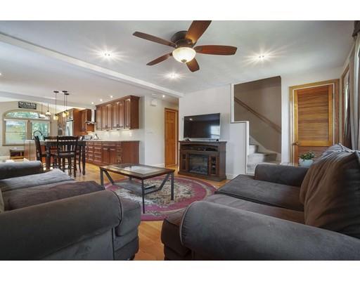 18 Community Road Billerica, MA 01821 - Photo 5 of 22 a living room with furniture kitchen view and a chandelier