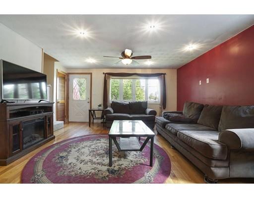 18 Community Road Billerica, MA 01821 - Photo 6 of 22 a living room with furniture and a flat screen tv