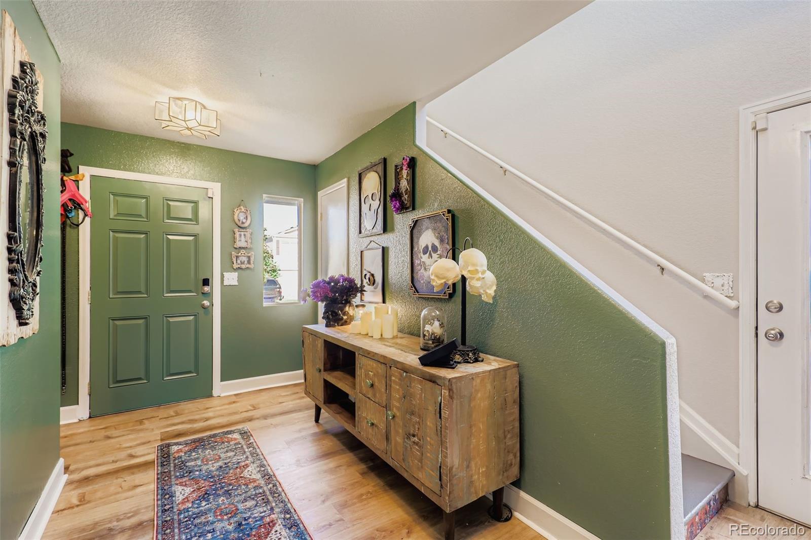 4716 Andes Street Denver, CO 80249 - Photo 3 of 27 a view of entryway with a rug