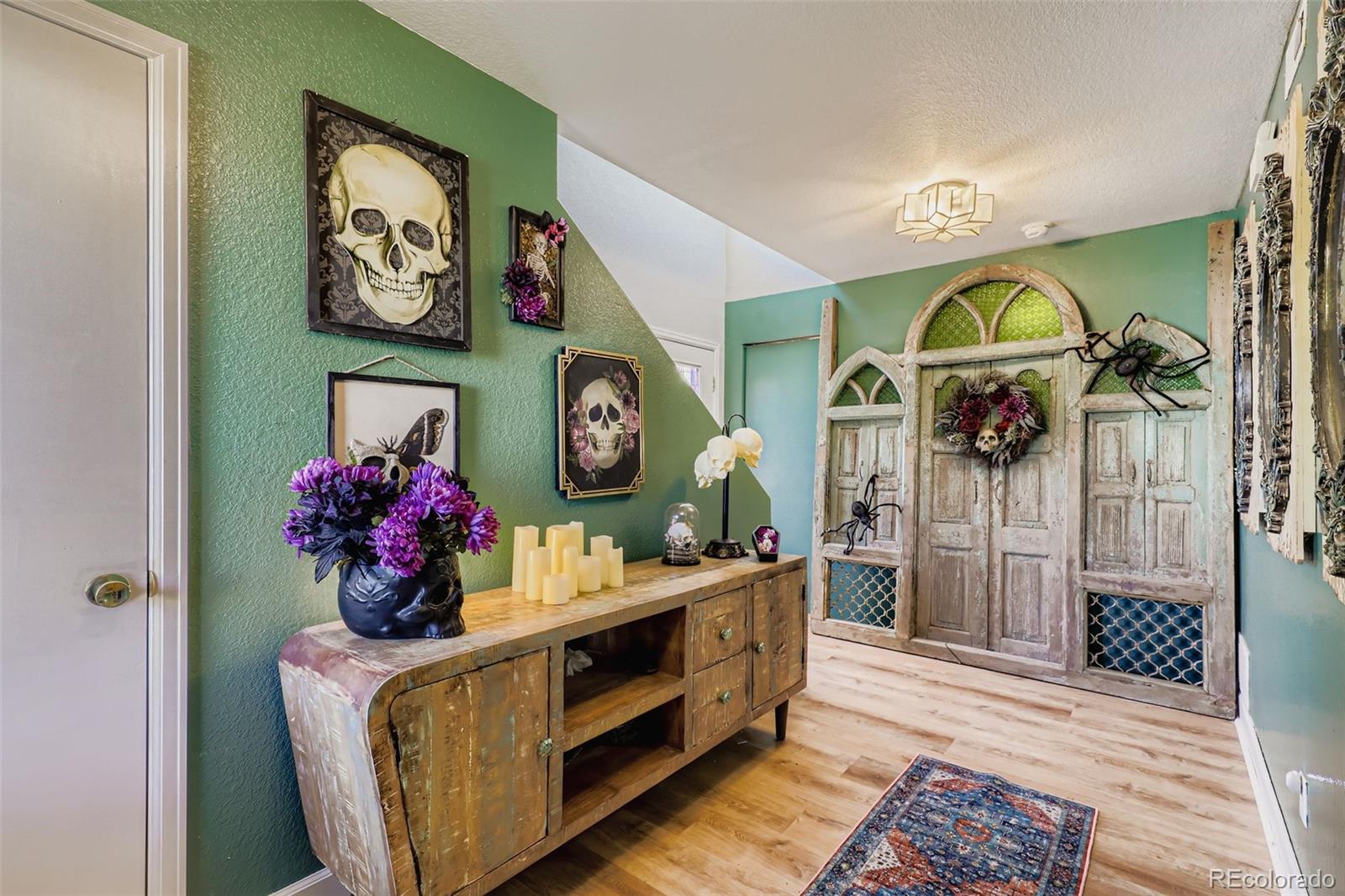 4716 Andes Street Denver, CO 80249 - Photo 4 of 27 a living room with furniture and painting on the wall
