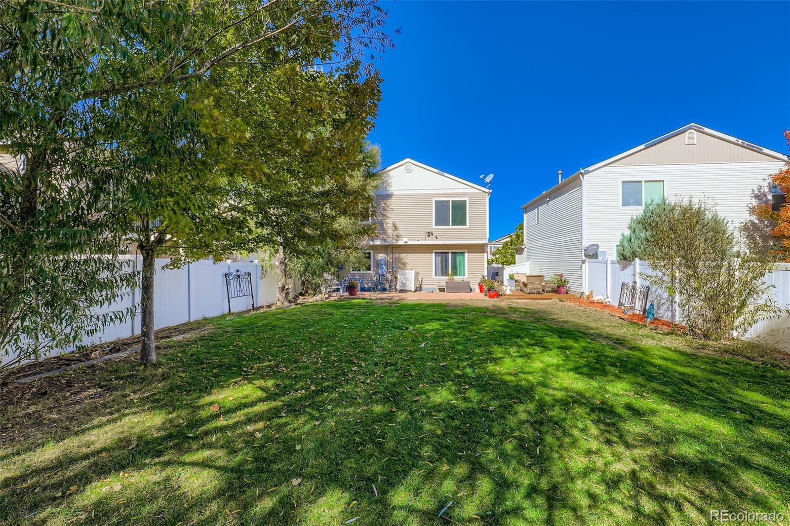4716 Andes Street Denver, CO 80249 - Photo 5 of 5 a view of a house with a yard