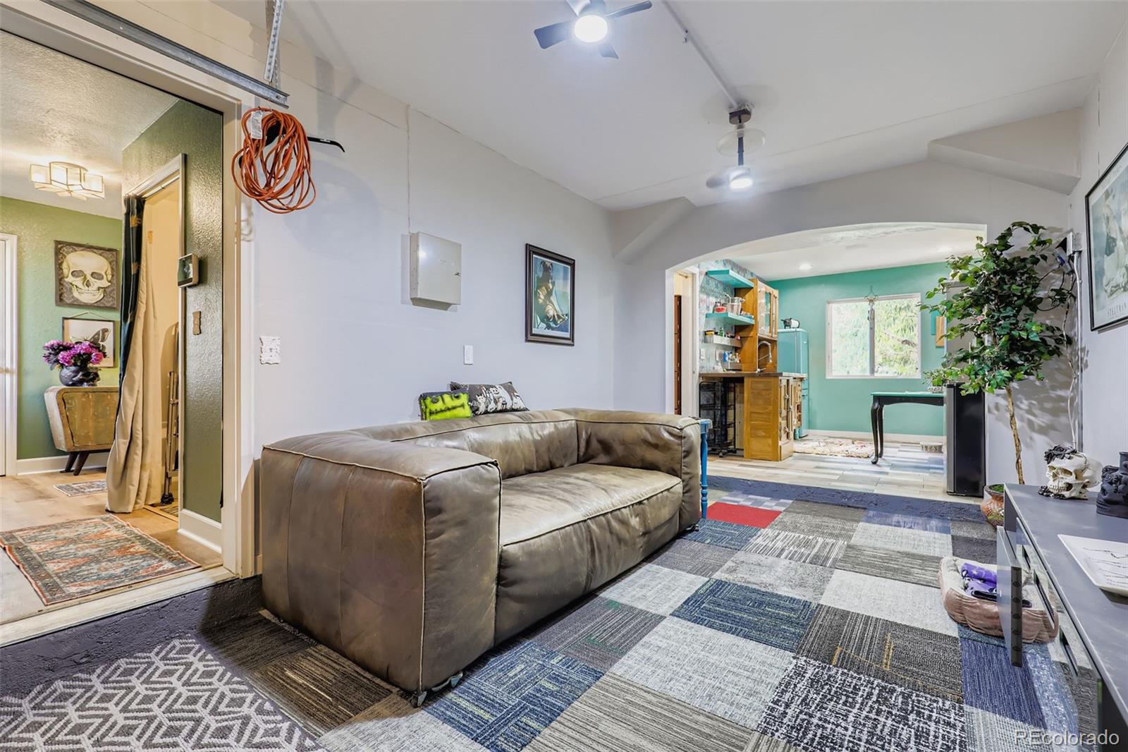 4716 Andes Street Denver, CO 80249 - Photo 5 of 27 a living room with furniture and a rug
