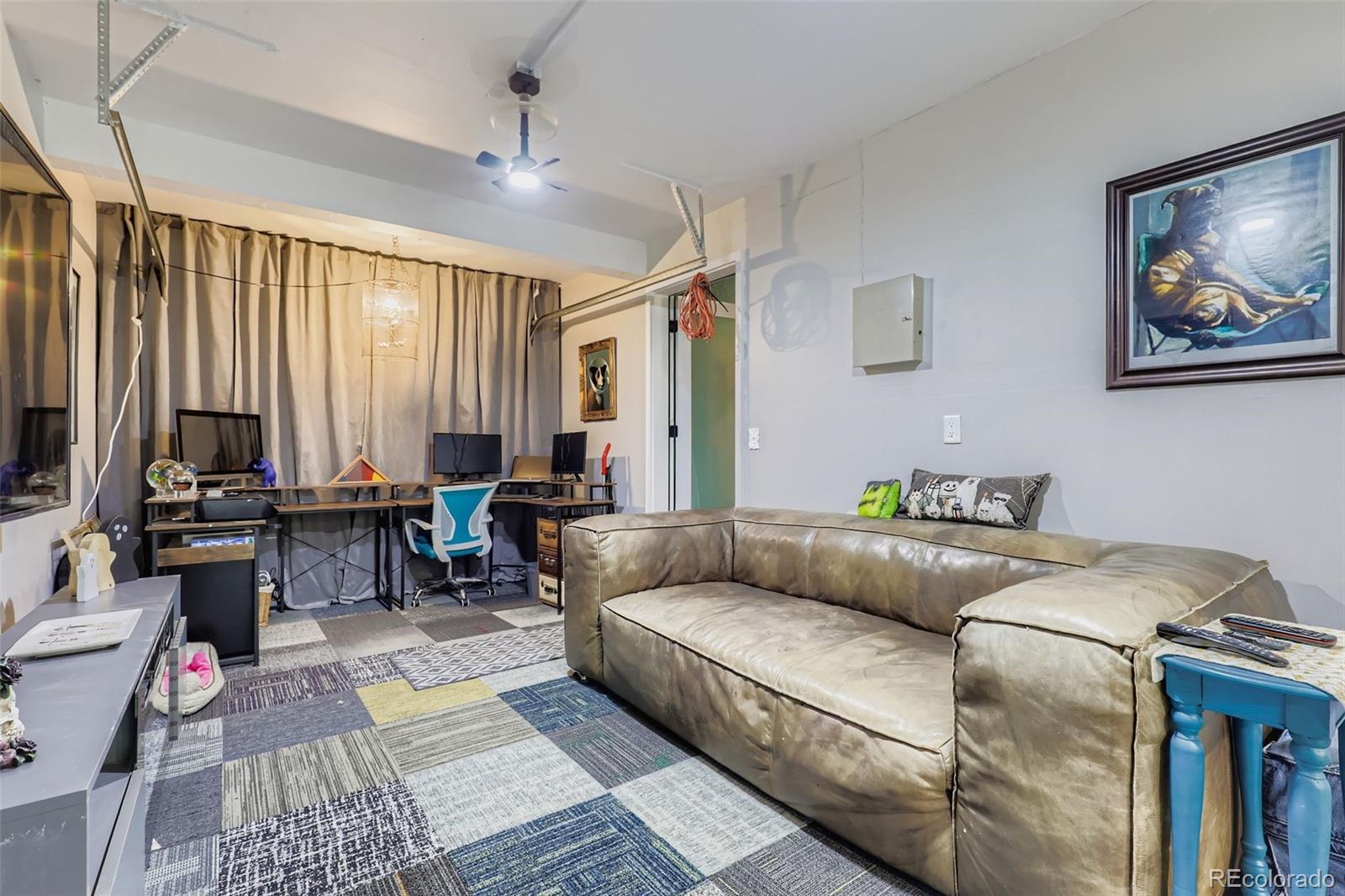 4716 Andes Street Denver, CO 80249 - Photo 6 of 27 a living room with furniture and a large window