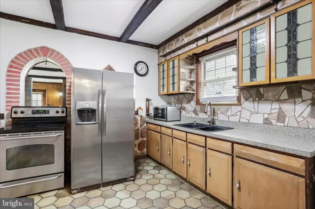 a front view of a house with outdoor seating