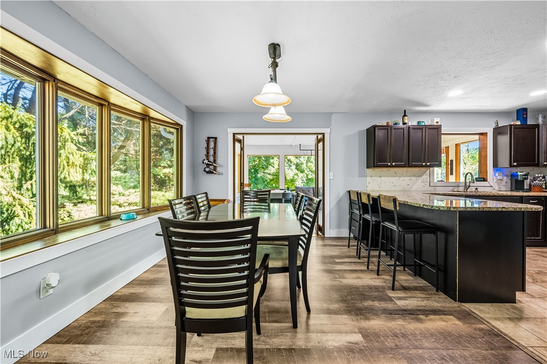 8193 Hartman Road Wadsworth, OH 44281 - Photo 12 of 50 Dining space with light wood-style flooring and baseboards