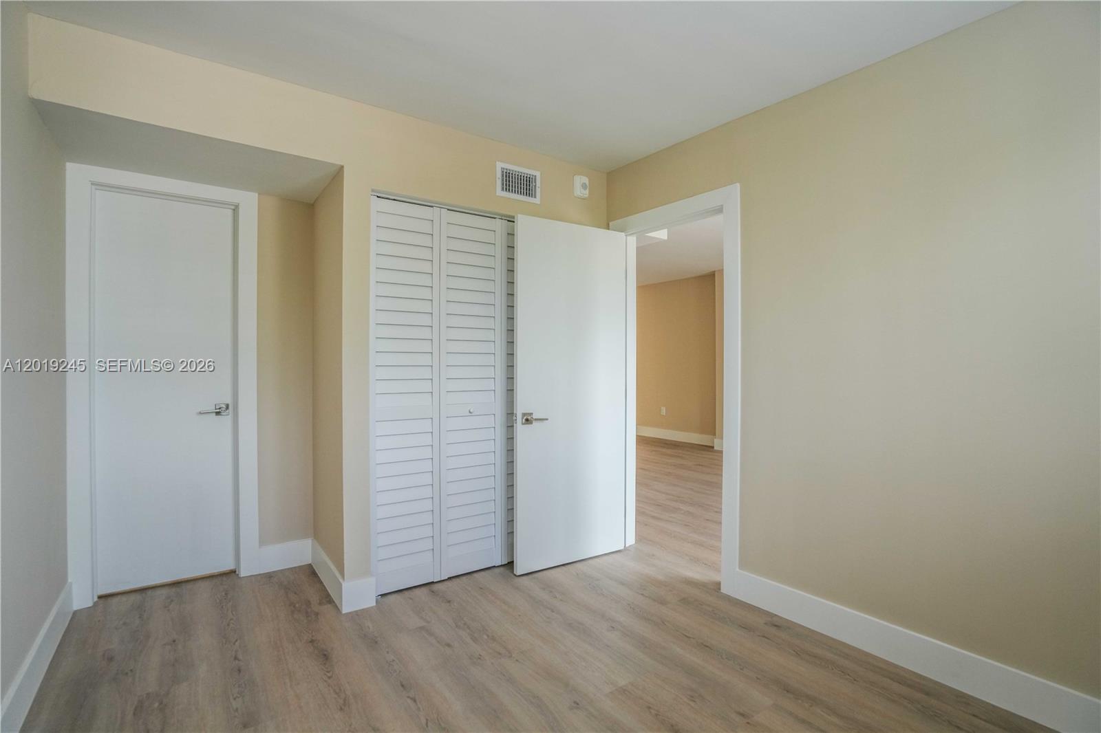 6960 Rue Vendome, Unit 201 Miami Beach, FL 33141 - Photo 15 of 27 a view of an empty room with closet and a window