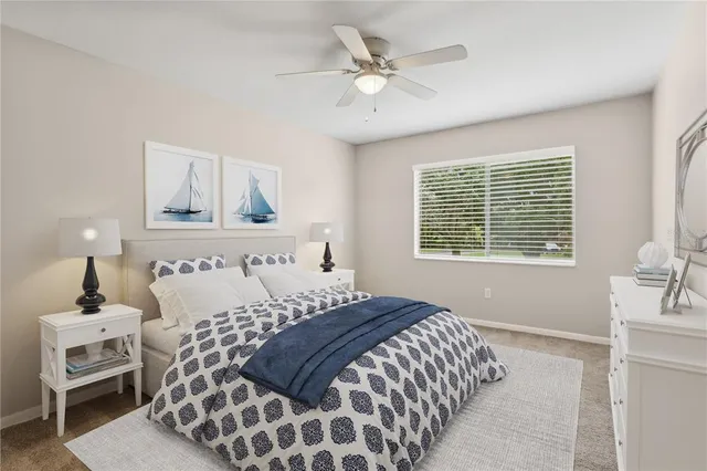 a bedroom with a large bed and a window