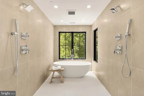 a bathroom with a bathtub and shower