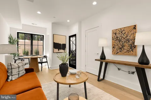 a living room with furniture and a table
