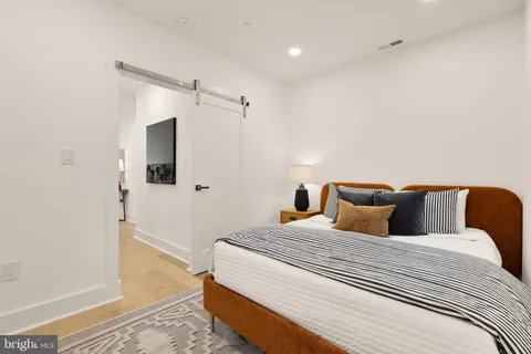 a bedroom with a bed and a walk in closet
