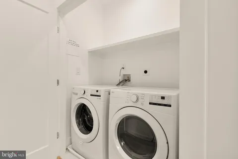 a view of livingroom with washer and dryer