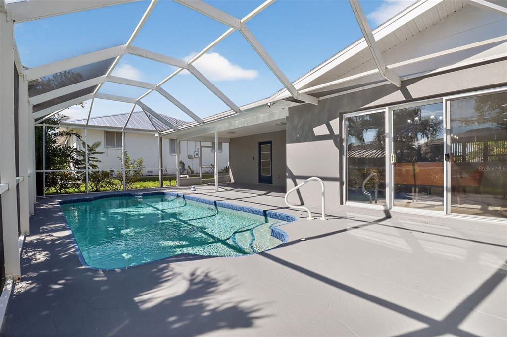 4210 Palm Drive Punta Gorda, FL 33950 - Photo 26 of 30 a view of a patio with table and chairs