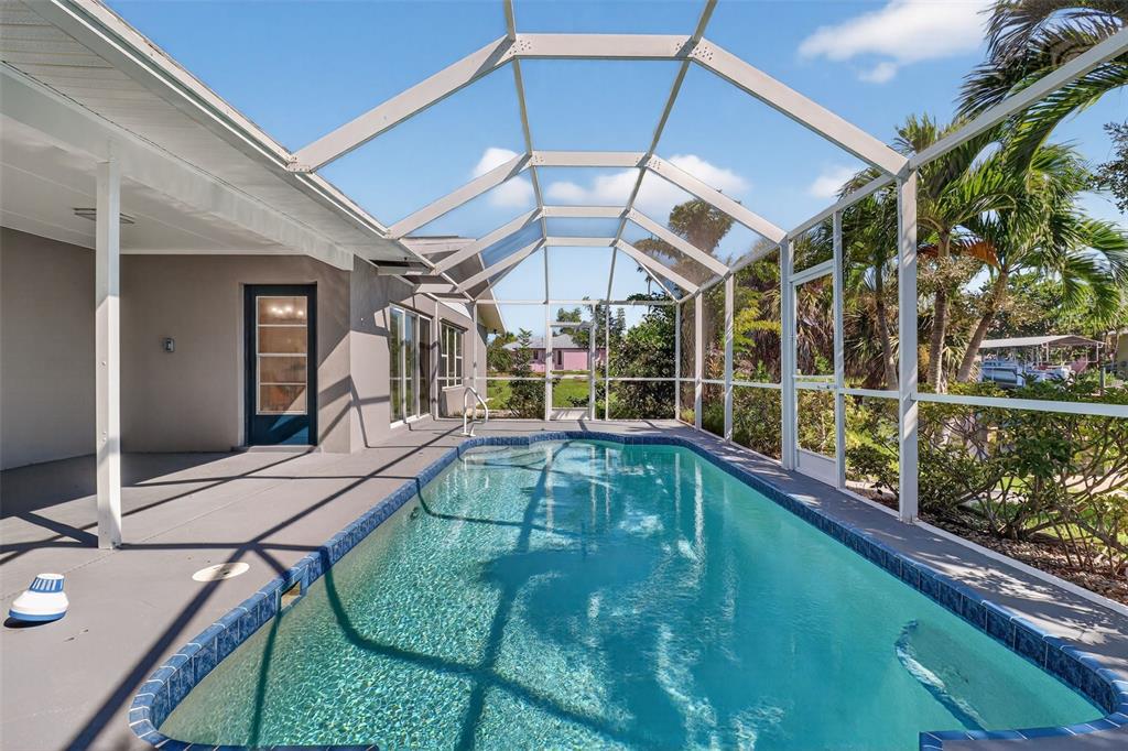 4210 Palm Drive Punta Gorda, FL 33950 - Photo 27 of 30 a view of a swimming pool with a patio